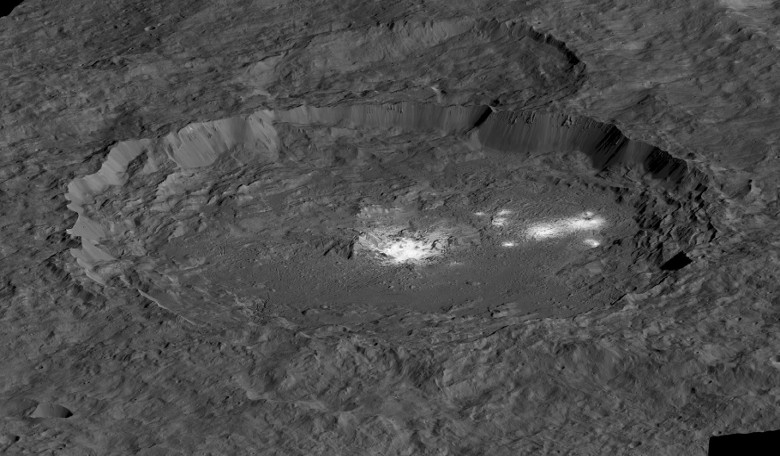 A simulated perspective view, facing north of Occator Crater, measuring 92 kilometres across and 4 kilometres deep, which contains the brightest area on Ceres. Image: NASA