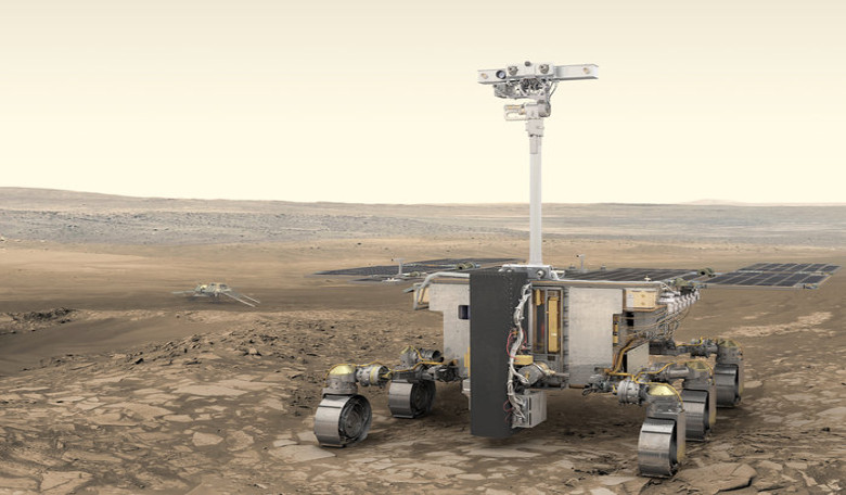 ESA’s ExoMars rover, Rosalind Franklin, is seen here with Russia’s stationary surface science platform (background) both of which are scheduled for launch in July 2020, arriving at Mars in March 2021. Image:ESA/ATG medialab