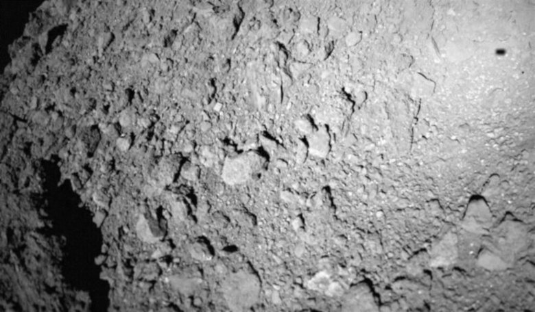 The MASCOT lander captured this image of asteroid Ryugu while descending to the asteroid’s surface on 3 October, 2018. The lander’s shadow is visible in the upper right. Image: DLR