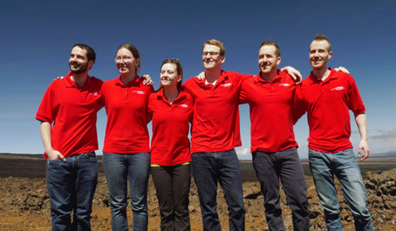 Crew members pose for a photo 17 September, 2017, after emerging from their habitat, after eight months of living in isolation in a Mars-like habitat in Mauna Loa volcano, Big Island, Hawaii. Image: University of Hawaii