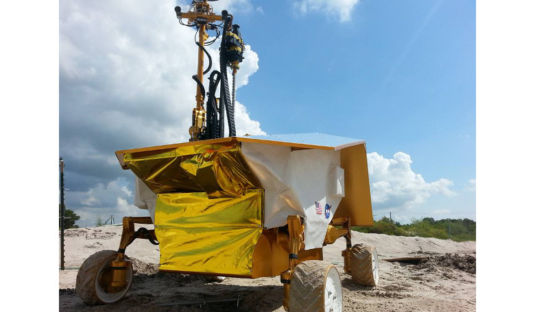 The Resource Prospector prototype searches for a buried sample tube at the Johnson Space Center rock yard in August 2015. Image: NASA