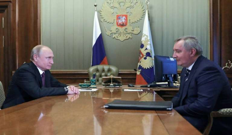 Russian President Vladimir Putin (left) meets appointed former deputy prime minister Dmitry Rogozin to head the country's space agency.