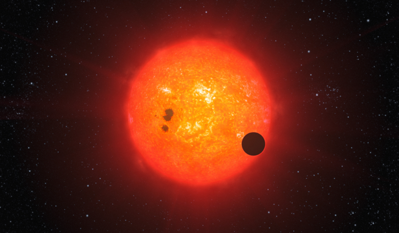 An artist's impression of an exoplanet transiting a red dwarf star. Image: ESO/L. Calçada