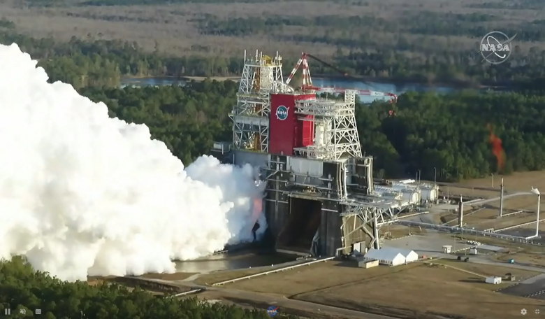 The core stage for the first flight of NASA’s Space Launch System rocket is seen in the B-2 Test Stand during a hot fire test 16 January, 2021, at NASA’s Stennis Space Center near Bay St. Louis, Mississippi. Image: NASA Television