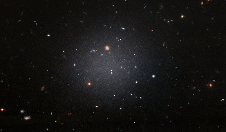 NGC 1052-DF2 resides about 65 million light-years away in the NGC 1052 Group, which is dominated by a massive elliptical galaxy called NGC 1052. Image: NASA, ESA, and P. van Dokkum (Yale University)