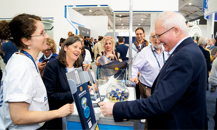 The busy Asgardia and ROOM booth at IAC 2023 during a visit from Head of Nation Dr Igor Ashurbeyli.