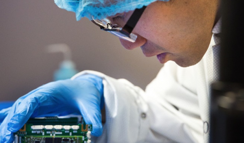 Just like larger satellites, Cubesat assembly and testing takes place a clean room. Each bench contains an in-production satellite.