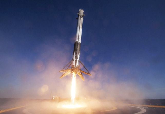 issue9-closeup-view-of-falcon-f9-first-stage-landing-on-specially-converted-barge-at-sea.jpg