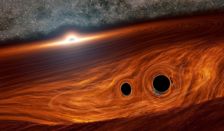 Artist's concept of a supermassive black hole surrounded by a disk of gas with two smaller black holes that may have merged together to form a new black hole. [Caltech/R Hurt]