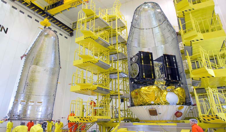 Installed atop Soyuz’ Fregat upper stage, the two Galileo FOC satellites and their dispenser system are shown partially encapsulated by the two-piece protective payload fairing. Image Credit: ESA/CNES/Arianespace/JM GUILLON