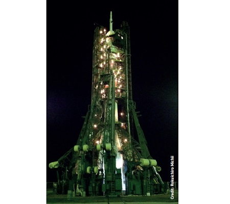 The Soyuz TMA-17M rocket illuminated at night