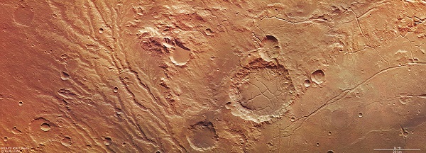 The Arda Valles region of Mars, comprising the network of drainage valleys seen in the left-hand portion of the image. The region lies on the western rim of an ancient large impact basin, which can be seen in the right-hand portion of the image. 