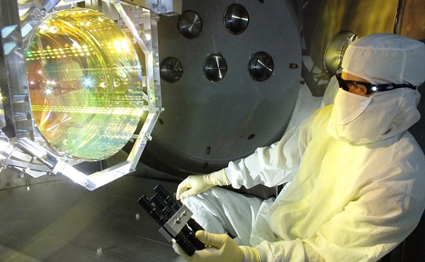 AA technician tests one of the suspended mirrors of the Advanced LIGO detector at Livingston, Louisiana